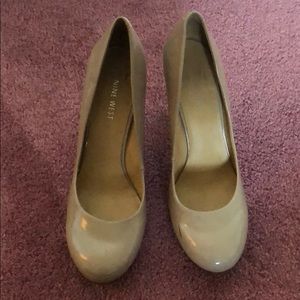 Tan heels. scuffs on the front. rounded toe